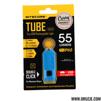 NITECORE Tube V2.0 LED keychain light with USB charging port, displayed on its packaging which is predominantly yellow and black with additional product information.